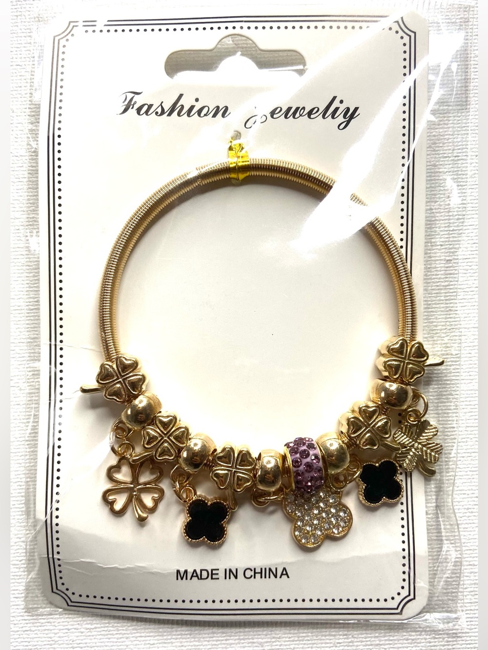 Fashion Jewelry Gold Clover Charm Bracelet with Black and Purple Accents